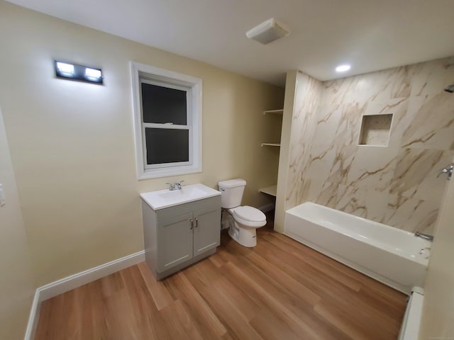 full bath with toilet, vanity, bathtub / shower combination, and wood finished floors
