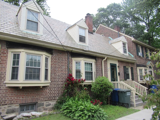 164 Flanders St, Bridgeport, CT 06604 - view of front of property featuring brick siding and a chimney