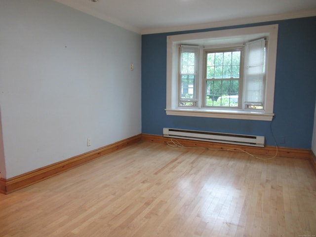 164 Flanders St, Bridgeport, CT 06604 - spare room featuring baseboard heating, ornamental molding, baseboards, and wood finished floors