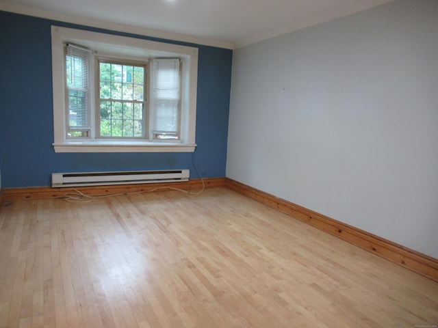 164 Flanders St, Bridgeport, CT 06604 - spare room featuring a baseboard radiator, baseboards, wood finished floors, and ornamental molding