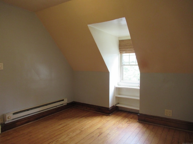164 Flanders St, Bridgeport, CT 06604 - bonus room featuring baseboard heating, wood-type flooring, and vaulted ceiling