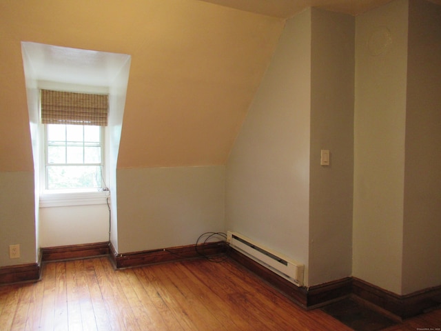 164 Flanders St, Bridgeport, CT 06604 - additional living space with a baseboard radiator, wood-type flooring, baseboards, and lofted ceiling