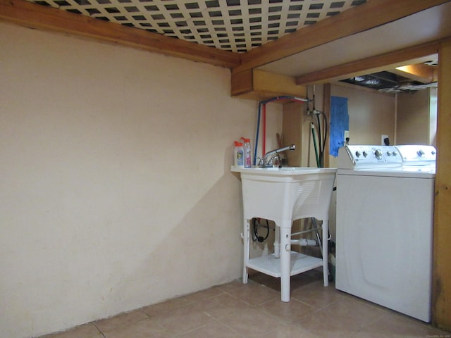 164 Flanders St, Bridgeport, CT 06604 - laundry area with separate washer and dryer and light tile patterned floors