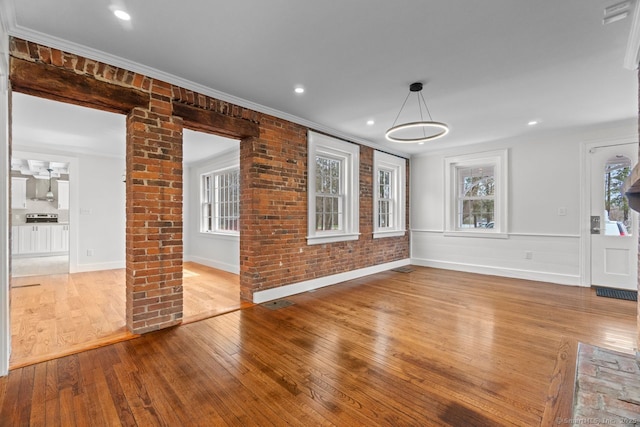 280 Mill Rd, North Haven, CT 06473 - unfurnished living room with wood-type flooring, plenty of natural light, baseboards, crown molding, and recessed lighting