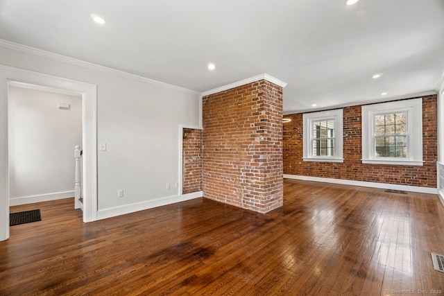 280 Mill Rd, North Haven, CT 06473 - unfurnished living room featuring brick wall, wood-type flooring, baseboards, crown molding, and recessed lighting