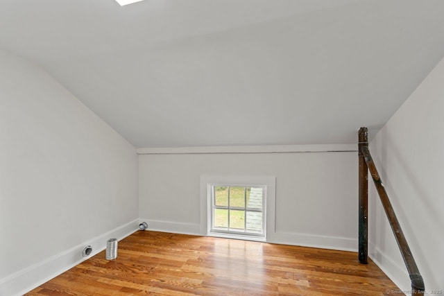 280 Mill Rd, North Haven, CT 06473 - bonus room with vaulted ceiling, light wood finished floors, and baseboards