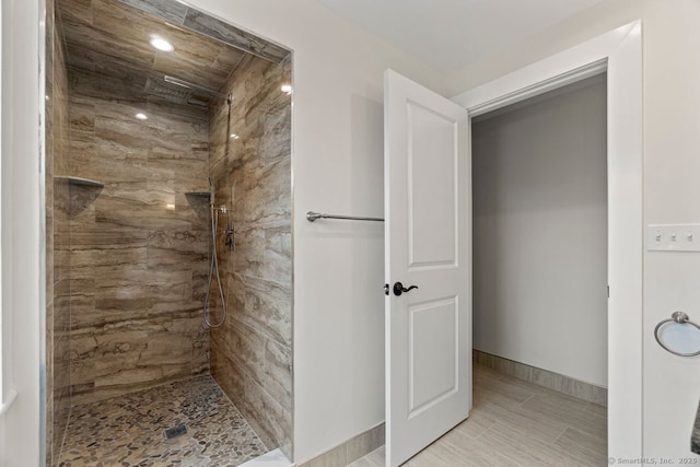 280 Mill Rd, North Haven, CT 06473 - bathroom featuring a tile shower and baseboards