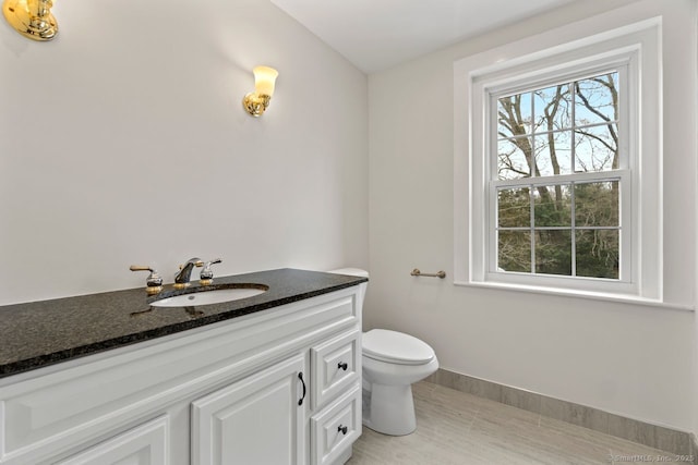 280 Mill Rd, North Haven, CT 06473 - half bathroom with toilet, vanity, and baseboards