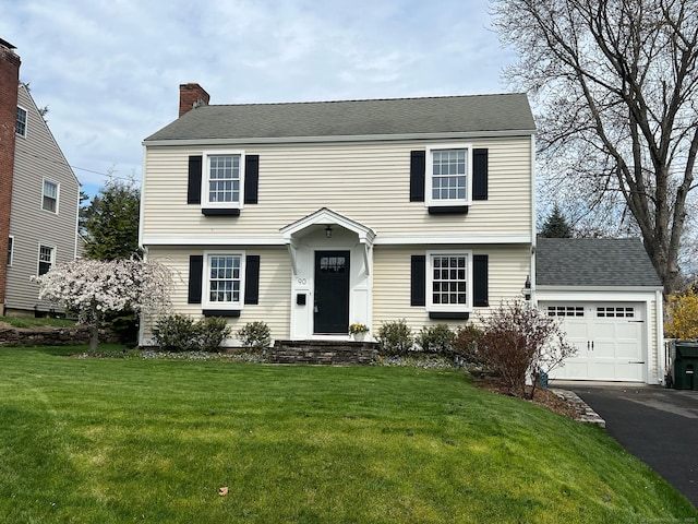 90 Bentwood Rd, West Hartford, CT 06107 - colonial home featuring a front yard, driveway, a garage, and a chimney