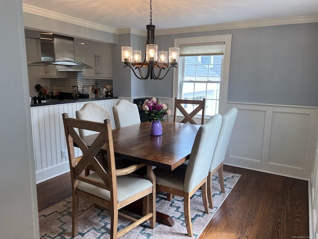 90 Bentwood Rd, West Hartford, CT 06107 - dining room with a decorative wall, a chandelier, crown molding, and dark wood finished floors