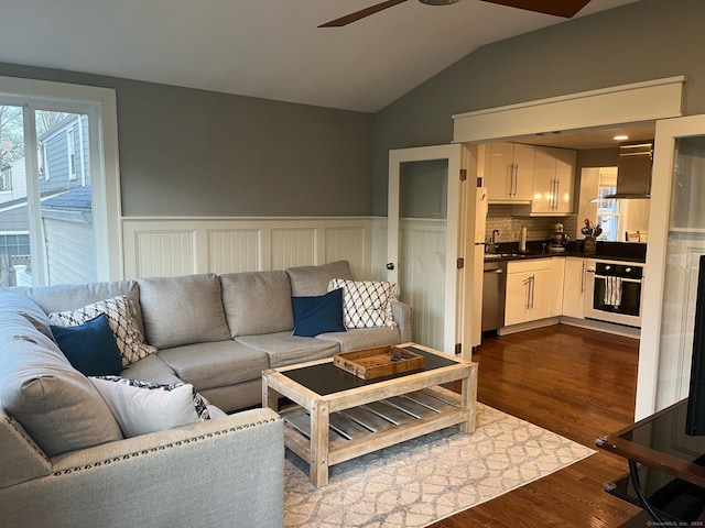 90 Bentwood Rd, West Hartford, CT 06107 - living room with dark wood finished floors, wainscoting, a ceiling fan, and lofted ceiling