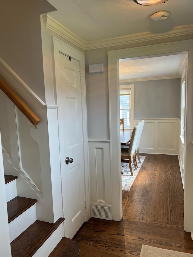 90 Bentwood Rd, West Hartford, CT 06107 - interior space featuring ornamental molding, stairs, visible vents, a decorative wall, and wood finished floors