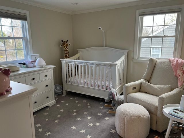90 Bentwood Rd, West Hartford, CT 06107 - bedroom featuring dark carpet, multiple windows, crown molding, and a nursery area