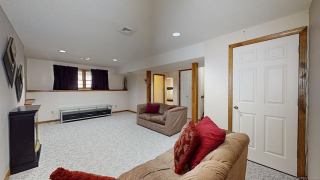 carpeted living room featuring recessed lighting, visible vents, and baseboards