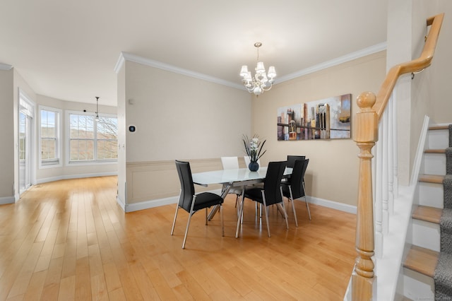 19 Mill Rd Unit 19, Danbury, CT 06810 - dining area with light wood-style flooring, baseboards, a notable chandelier, stairway, and crown molding