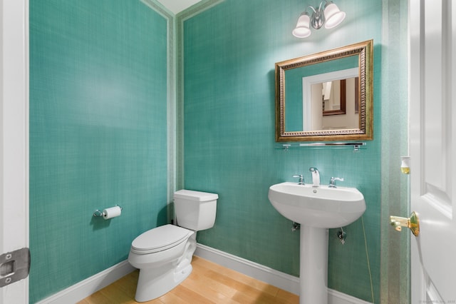 19 Mill Rd Unit 19, Danbury, CT 06810 - half bathroom featuring wood finished floors, toilet, and a sink