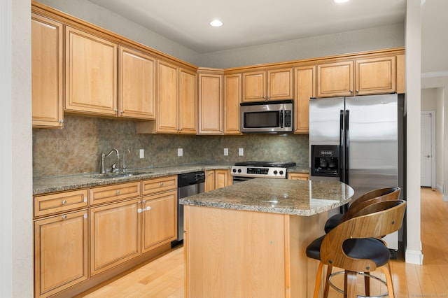 19 Mill Rd Unit 19, Danbury, CT 06810 - kitchen featuring stone counters, a sink, light wood-style floors, and appliances with stainless steel finishes