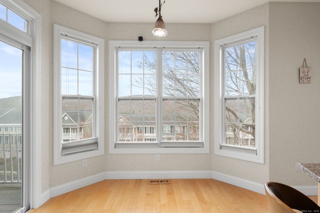 19 Mill Rd Unit 19, Danbury, CT 06810 - unfurnished dining area with wood finished floors, visible vents, and baseboards