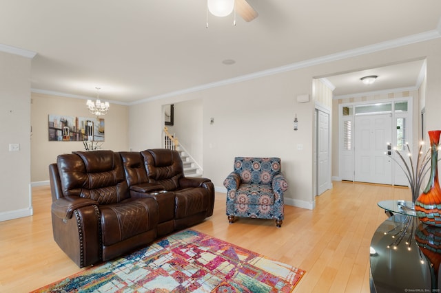 19 Mill Rd Unit 19, Danbury, CT 06810 - living area featuring light wood-style flooring, ornamental molding, and ceiling fan with notable chandelier