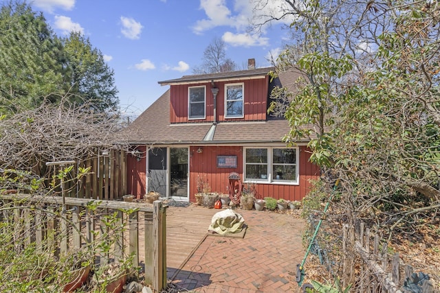 200 New Canaan Ave, Norwalk, CT 06850 - rear view of property with board and batten siding, roof with shingles, a chimney, and a deck