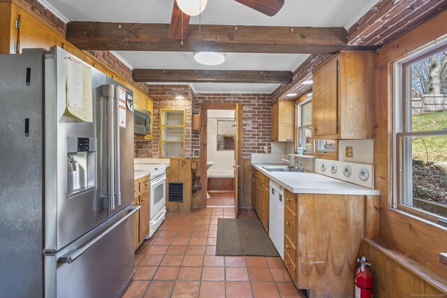 200 New Canaan Ave, Norwalk, CT 06850 - kitchen featuring appliances with stainless steel finishes, light countertops, beamed ceiling, and a healthy amount of sunlight