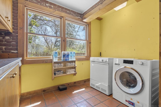 200 New Canaan Ave, Norwalk, CT 06850 - washroom with washing machine and clothes dryer, cabinet space, tile patterned floors, and plenty of natural light