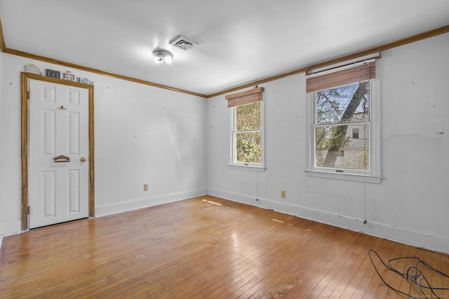200 New Canaan Ave, Norwalk, CT 06850 - spare room with light wood finished floors, baseboards, ornamental molding, and visible vents