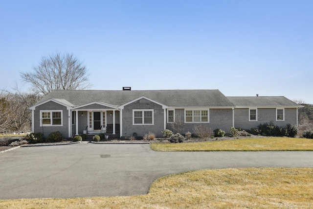ranch-style home with a front yard