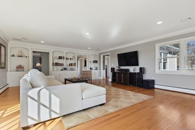 living area featuring baseboard heating, visible vents, ornamental molding, and wood finished floors