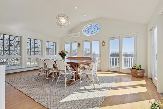 sunroom featuring high vaulted ceiling, recessed lighting, a wall mounted AC, a baseboard heating unit, and wood-type flooring