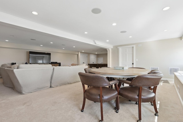 dining space with light carpet, recessed lighting, visible vents, and baseboards