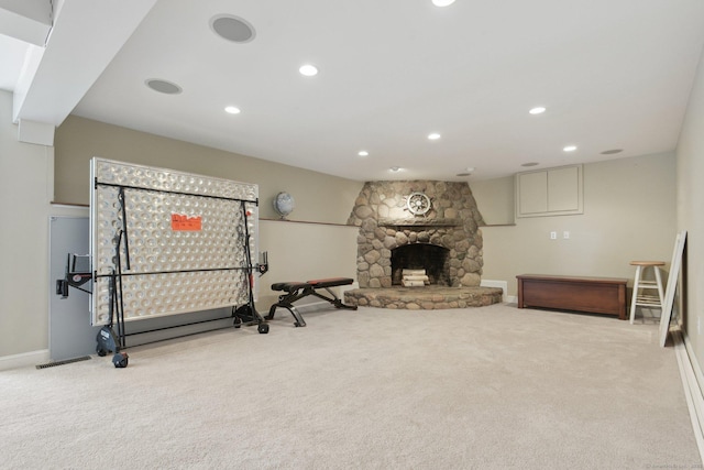 exercise area featuring a fireplace, visible vents, recessed lighting, carpet floors, and baseboards