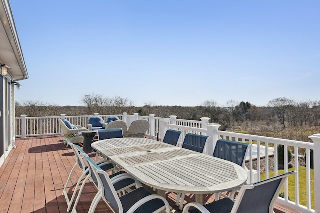 deck with outdoor dining area