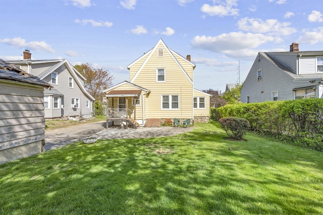 90 Culloden Rd, Stamford, CT 06902 - rear view of property with a yard and a chimney