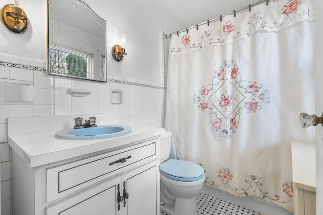 90 Culloden Rd, Stamford, CT 06902 - full bathroom with vanity, tile walls, and toilet