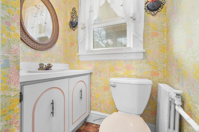90 Culloden Rd, Stamford, CT 06902 - half bath featuring toilet, wallpapered walls, brick floor, vanity, and radiator heating unit