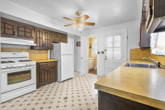 90 Culloden Rd, Stamford, CT 06902 - kitchen with a sink, white appliances, light floors, under cabinet range hood, and ceiling fan