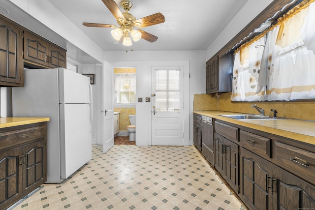 90 Culloden Rd, Stamford, CT 06902 - kitchen featuring a sink, freestanding refrigerator, light countertops, a ceiling fan, and dark brown cabinets