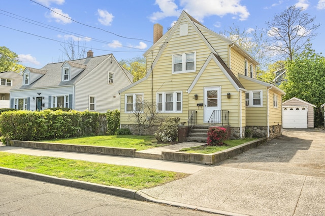 90 Culloden Rd, Stamford, CT 06902 - view of front of house with a chimney, driveway, an outdoor structure, a detached garage, and a front yard