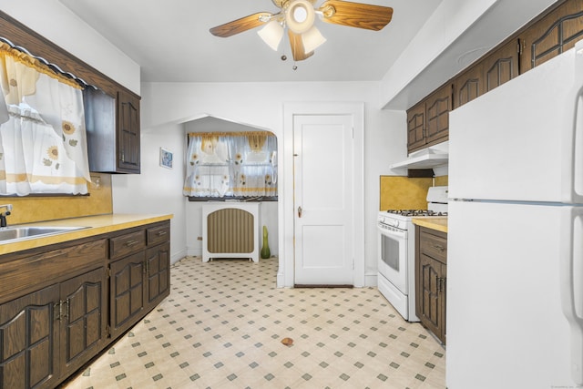 90 Culloden Rd, Stamford, CT 06902 - kitchen with under cabinet range hood, light countertops, a ceiling fan, and white appliances