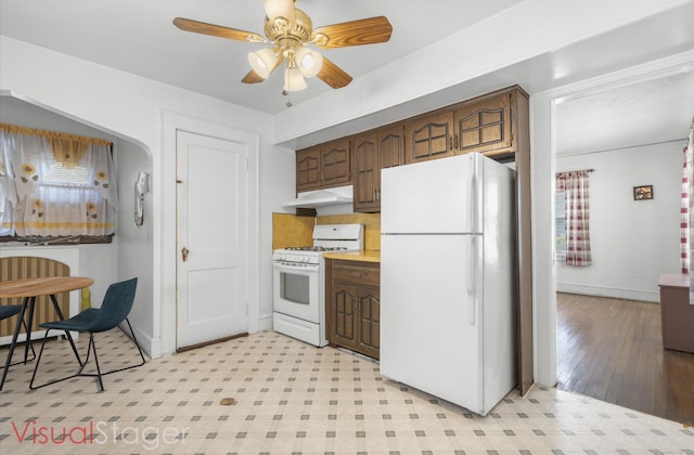 90 Culloden Rd, Stamford, CT 06902 - kitchen featuring white appliances, under cabinet range hood, light countertops, a ceiling fan, and baseboards
