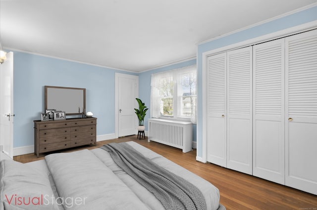 90 Culloden Rd, Stamford, CT 06902 - bedroom featuring crown molding, wood finished floors, baseboards, and radiator heating unit