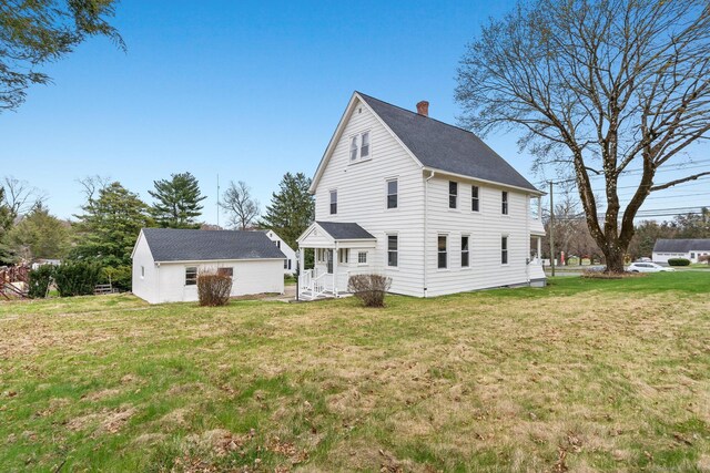 189 Derby Ave, Orange, CT 06477 - rear view of property with a chimney, a lawn, and roof with shingles