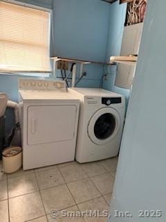 278 Wall St, Waterbury, CT 06704 - washroom with washing machine and dryer, laundry area, and light tile patterned flooring