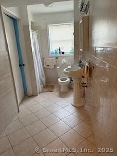 278 Wall St, Waterbury, CT 06704 - full bath with tile patterned flooring, a shower with curtain, and toilet