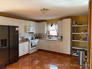 278 Wall St, Waterbury, CT 06704 - kitchen with white appliances and white cabinetry