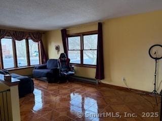 278 Wall St, Waterbury, CT 06704 - living area featuring a textured ceiling