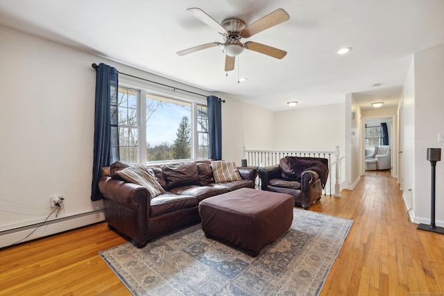 living room featuring a healthy amount of sunlight and light wood-style flooring