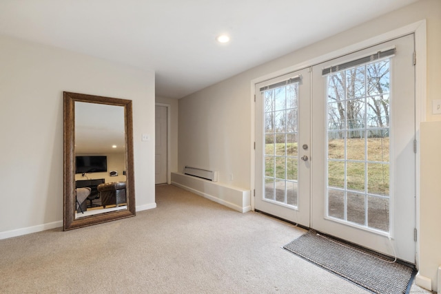 doorway featuring a baseboard heating unit, french doors, carpet flooring, baseboards, and recessed lighting
