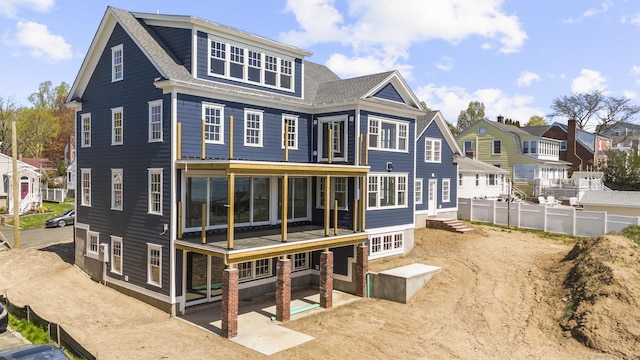 47 Lucey Ave, West Haven, CT 06516 - back of house featuring fence, a residential view, and roof with shingles